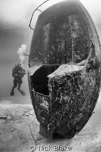 vertical standing boat wreck and diver, Wraysbury, Middle... by Nick Blake 
